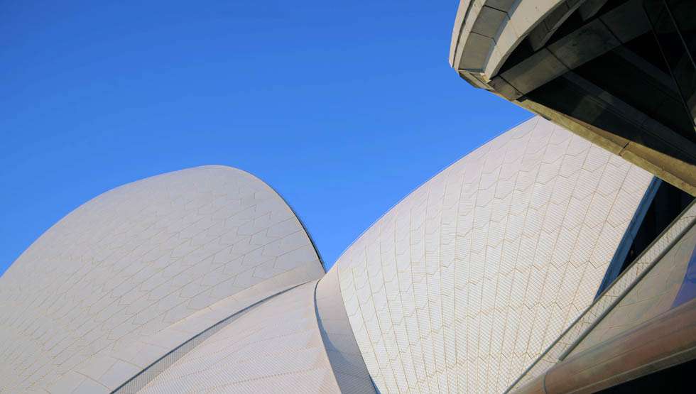 For architect Jorn Utzon, this difference between Snow and Ice tiles echoed his experience of light reflecting off the European Alps. 